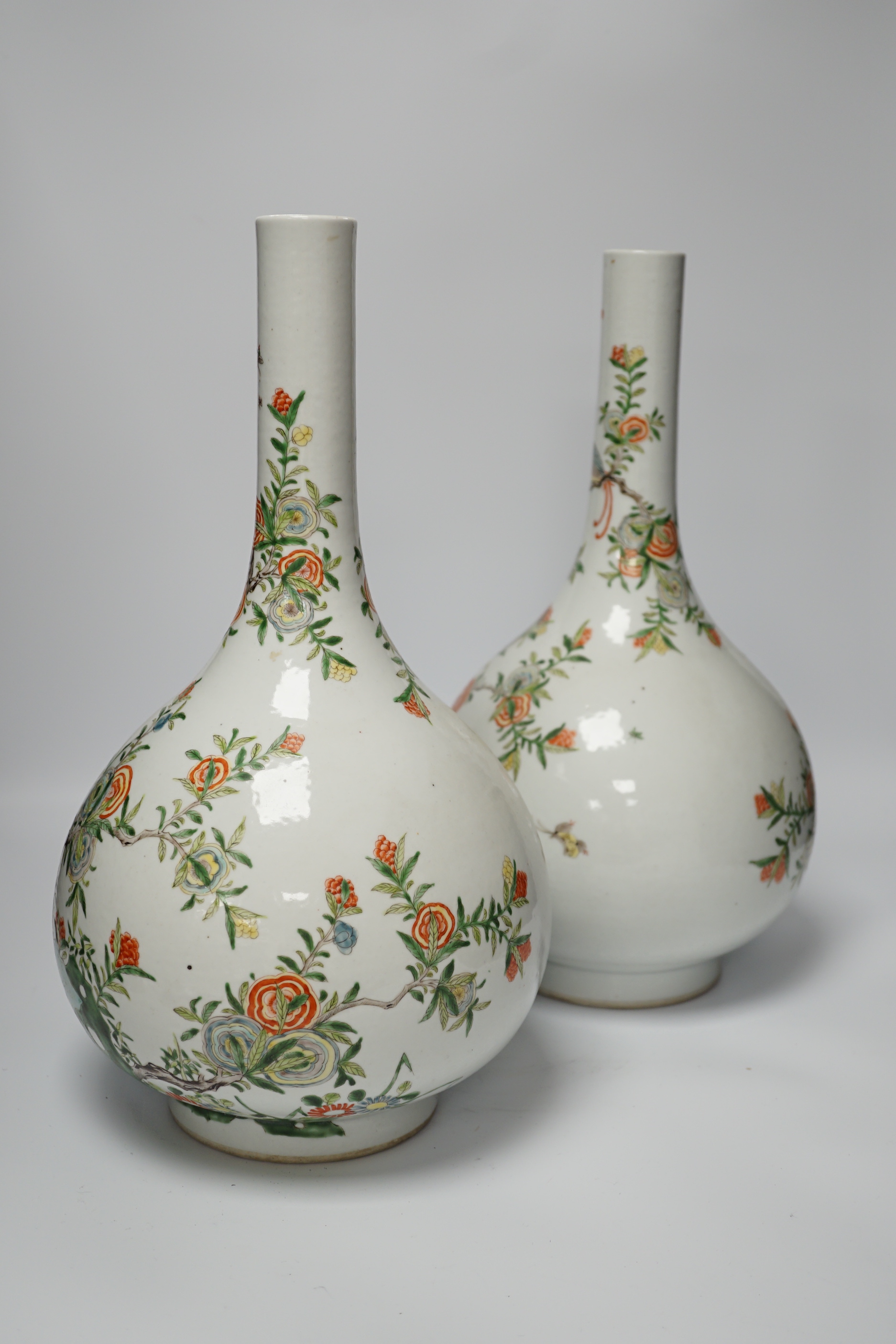 A pair of modern Chinese Kangxi style famille verte bottle vases, 40cm high